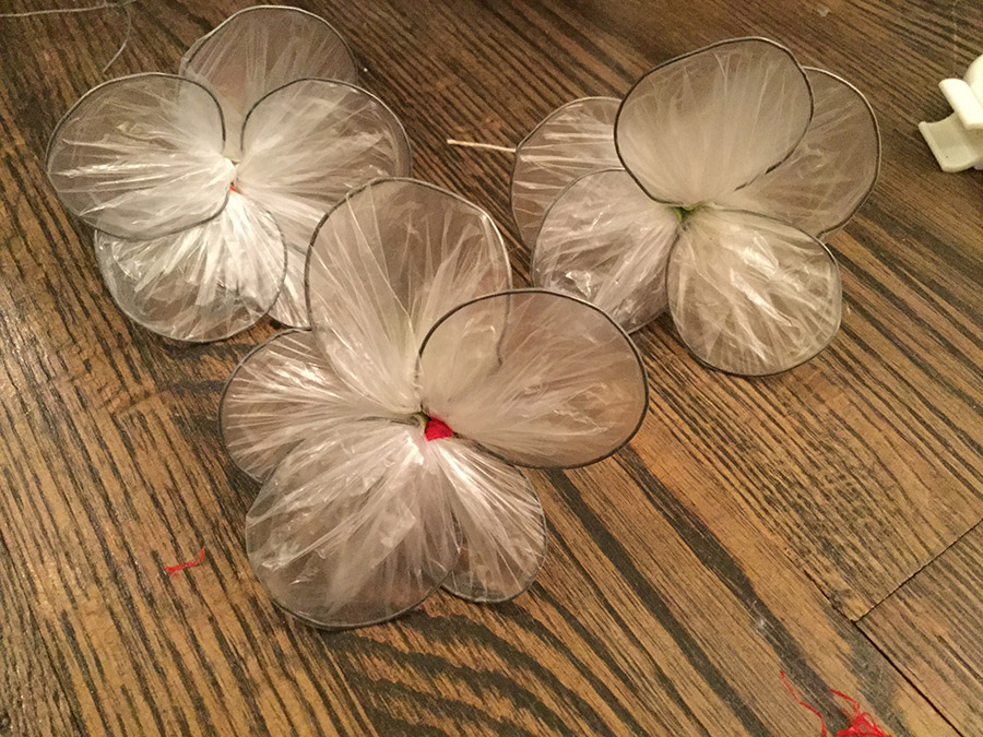 flowers made of plastic bag, 5 small round petals each.